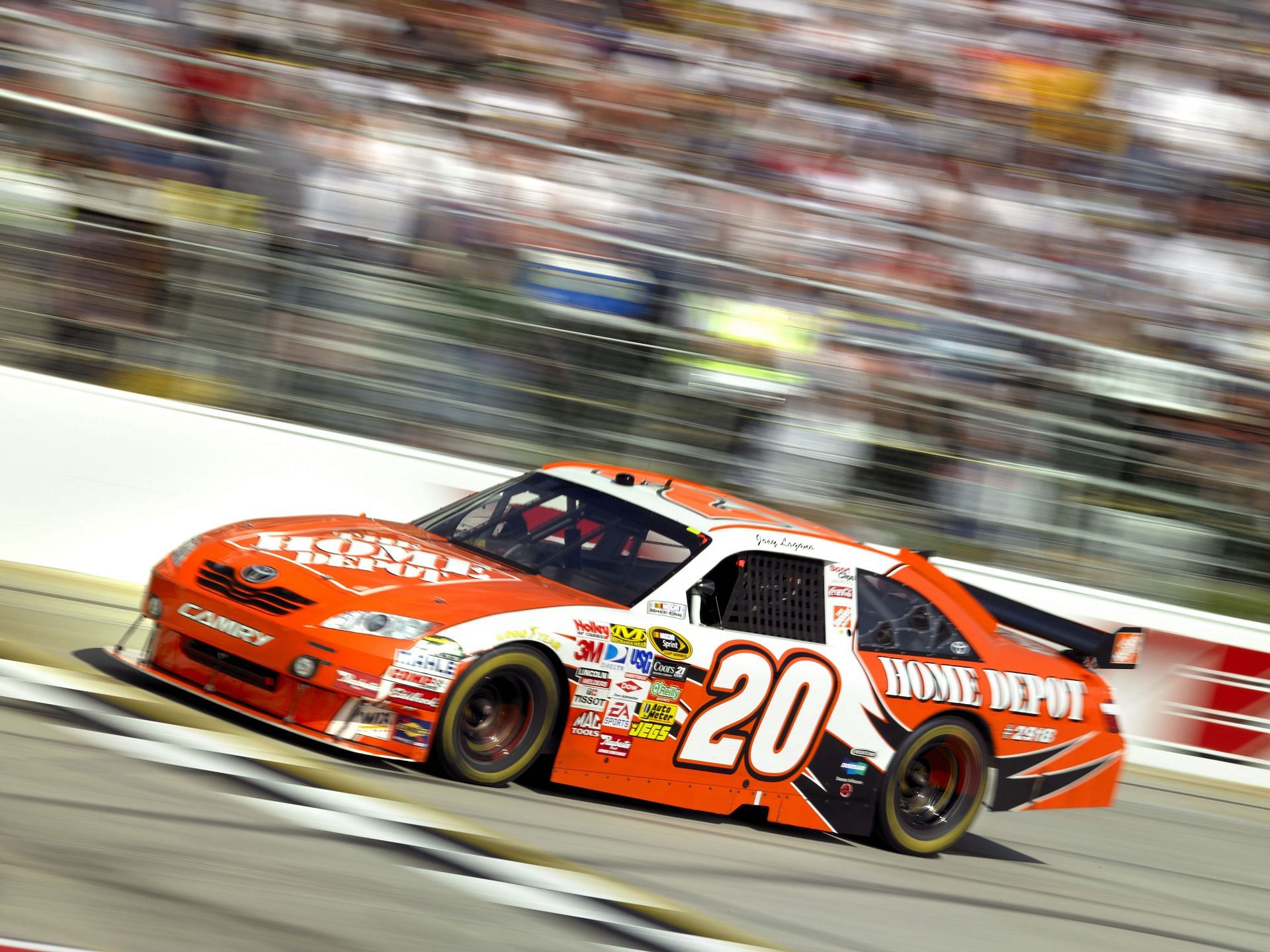 Joey Logano driving the #20 Joe Gibbs Racing at Dover Motor Speedway in 2009 - Source: Getty
